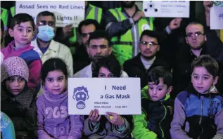  ?? Mohammed Badra / EPA ?? Cry for help. Syrian children and first aiders make a plea to the watching world after the chemical attack in Khan Sheikhoun. Reports state 80 people, including 20 children, were killed.