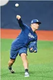  ?? — AFP photo ?? Los Angeles Dodgers’ pitcher Yoshinobu Yamamoto attends a baseball workout at Gocheok Sky Dome in Seoul.