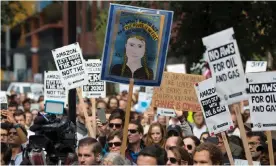  ?? Photograph: Jason Redmond/AFP via Getty ?? Amazon Employees for Climate Justice lead a walk-out at the company’s HQ in Seattle.