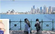  ?? REUTERS ?? People walk along the harbour waterfront across from the Sydney Opera House during a lockdown to curb the spread of Covid.