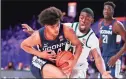  ?? Tim Aylen / Associated Press ?? UConn’s Andre Jackson (44) drives to the basket while defended by Michigan State’s Gabe Brown on Thursday at Paradise Island, Bahamas.