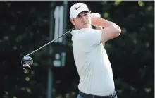  ?? LYNNE SLADKY THE ASSOCIATED PRESS ?? Brooks Koepka hits from the 11th tee during the first round of The Players Championsh­ip golf tournament Thursday in Ponte Vedra Beach, Fla.