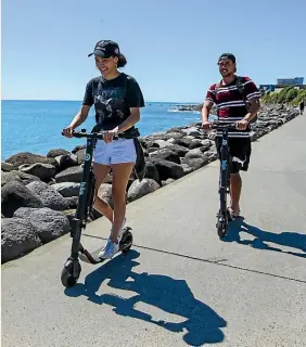  ?? LIAM COURTENAY/STUFF ?? Cheyenne Shelford and Teone Phillips of New Plymouth said they would be using the scooters again after a great ride yesterday.