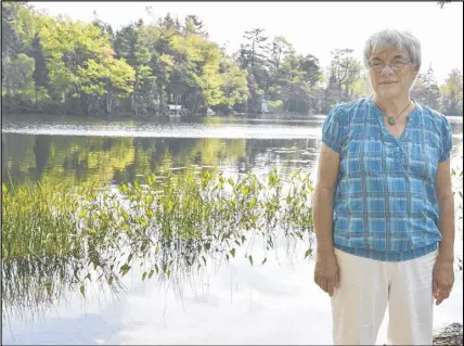  ?? SalTWire neTWorK phoTo ?? Lydia Sorflaten stands on her property next to Shortts Lake, some 500 metres from the Lafarge Brookfield cement plant.