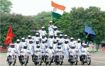  ?? — PTI ?? Army personnel perform a daredevil stunt during ‘Army Mela’ at the Grenadiers Regiment Centre parade ground in Jabalpur on Saturday.