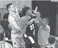  ?? ADAM CAIRNS/COLUMBUS DISPATCH ?? Ohio State’s E.J. Liddell (32) and Kyle Young (25) have often teamed up on the court, as they do here against Purdue’s Jaden Ivey. Last week they teamed up to represent OSU at Big Ten media days.