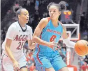  ?? MARLA BROSE/JOURNAL ?? Cherise Beynon, right, tries to get past NMSU’s Monique Mills, left, on Saturday, November 18, 2017 in Dreamstyle Arena — The Pit.