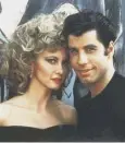  ??  ?? 0 Olivia Newton-john and John Travolta in Grease