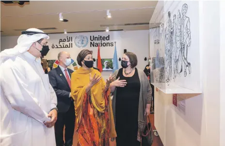  ?? Expo 2020 Dubai; Antonie Robertson / The National ?? UN deputy secretary general Amina Mohammed, above centre, visits Expo 2020 Dubai with Najeeb Al Ali, above left, executive director of Expo 2020 Bureau, and Dena Assaf, above right, Resident UN Co-ordinator. Left, a wooden replica of the Knotted Gun statue at Expo. The original is outside UN headquarte­rs in New York