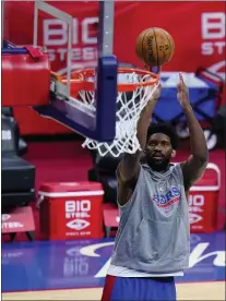  ?? MATT SLOCUM - THE ASSOCIATED PRESS ?? Sixers center Joel Embiid puts up shots before Game 5 against Washington on Wednesday. A meniscus tear kept the MVP candidate out of the game and could keep him sidelined for an indefinite period.