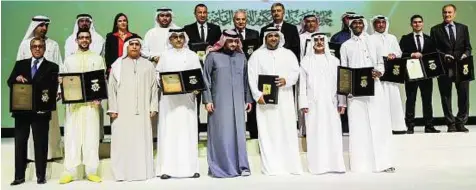  ??  ?? Glittering club Shaikh Nahyan Bin Mubarak Al Nahyan and Shaikh Ahmad Bin Mohammad Bin Rashid Al Maktoum with the winners of the Mohammad Bin Rashid Creative Sports Awards at Rashid Hall, Dubai World Trade Centre and Exhibition Halls.
Ahmed Ramzan/...