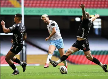 ??  ?? Adam Hastings kicks forward for Glasgow Warriors during their defeat to Dragons in Wales yesterday