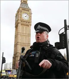  ??  ?? Armed police respond outside Parliament during the incident on Westminste­r Bridge in London.