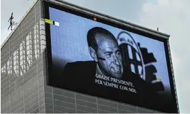  ?? Photograph: Piero Cruciatti/AFP/Getty Images ?? Not pretty, but popular … a giant screen depicting Silvio Berlusconi outside the AC Milan football club in Milan on Tuesday.