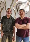  ??  ?? Artists Dan Havel, left, and Dean Ruck have created “Ripple,” their latest monumental sculpture installati­on.