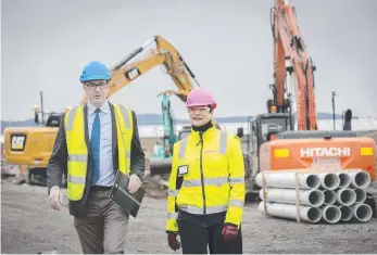  ??  ?? Minister for State Growth Michael Ferguson and Macquarie Point Developmen­t Corporatio­n CEO Mary Massina at Macquarie Point.
Picture: Chris Kidd