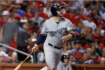  ?? AP PhoTo/JeFF RobeRson ?? In this 2017 file photo, Milwaukee Brewers’ Stephen Vogt watches his solo home run during the fourth inning of a baseball game against the St. Louis Cardinals, in St. Louis.