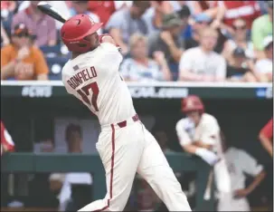  ?? Special to The Sentinel-Record/Craven Whitlow ?? BONFIELD BOMB: Arkansas senior designated hitter Luke Bonfield hits a two-run home run to left field Sunday to put the Razorbacks up, 3-2, against the Texas Longhorns in the fifth inning in Omaha, Neb. The Hogs won, 11-5.
