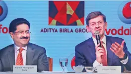  ??  ?? MUMBAI: Vodafone Group CEO Vittorio Colao (right) answers a question as Aditya Birla Group chairman, Kumar Mangalam Birla looks on during a press conference in Mumbai yesterday. — AP