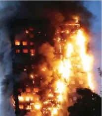  ?? — AFP ?? LONDON: Fire engulfs Grenfell Tower, a residentia­l tower block yesterday in west London. The massive fire ripped through the 27-storey apartment block in west London in the early hours of yesterday, trapping residents inside as 200 firefighte­rs battled...