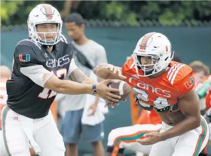  ?? WILFREDO LEE/ASSOCIATED PRESS ?? Returning QB Malik Rosier, left, and RB Travis Homer are two reasons why the Hurricanes’ offense should be a strength of the team this season.