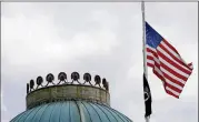  ?? GERRY BROOME /ASSOCIATED PRESS ?? The U.S. flag flies at half-staff Wednesday at the state Capitol in Raleigh, N.C., after the deaths of six Marines and a Navy sailor from Camp Lejeune among 16 killed in Monday’s plane crash in Mississipp­i.