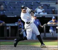  ??  ?? New York Yankees’ Aaron Judge hits a solo home run during the seventh inning of a baseball game against the Kansas City Royals at Yankee Stadium, Monday, Sept. 25, 2017, in New York. It was Judge’s 50th home run, which set a new record the most home...