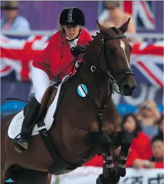 ?? ALEXANDER HASSENSTEI­N/ GETTY IMAGES ?? Pentathlet­e Donna Marie Vakalis of Canada competes in the Olympics in 2012. Under the Own the Podium funding model, Vakalis doesn’t receive government money for training.