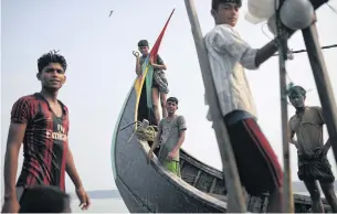  ?? REUTERS ?? Rohingya refugees on a fishing boat in the Bay of Bengal near Cox’s Bazar, Bangladesh.