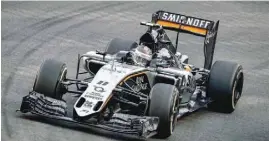  ?? — AFP ?? Sahara Force India F1 Team’s Mexican driver Sergio Perez powers his car during the third and final free practice session of the Singapore Grand Prix in Singapore.