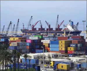  ?? (AP/Bilal Hussein) ?? Shipping containers are stacked at the Beirut Port in Lebanon last week.