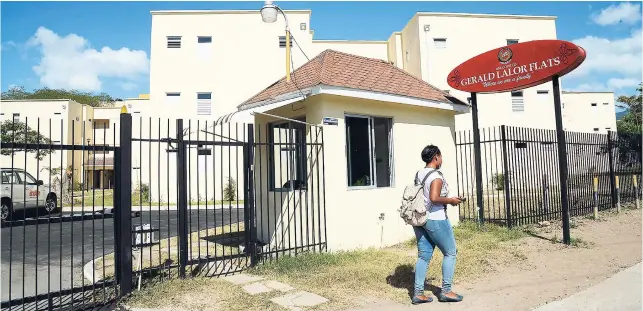  ??  ?? In this January 5, 2018 photo, a student walks by the Gerald Lalor Flats at UWI, Mona, one of the projects undertaken by 138 Student Living Jamaica.