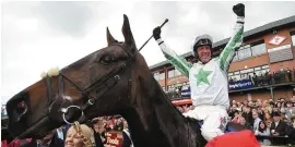  ??  ?? Robbie Power celebrates on Our Duke after winning last year’s Irish Grand National at Fairyhouse (above); and (left) Paul Carberry guides Bobbyjo over the final fence at the famous Meath course in 2000