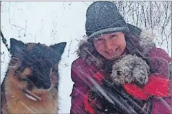  ?? SUBMITTED PHOTOS ?? Lindsay Parsons gives her Shih Tzu, Odie, a hug after finding him Tuesday in the middle of a snowstorm. A group effort lead to Odie’s rescue.