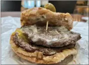  ?? ?? Swenson’s Galley Boy burgers were slightly greasy and tasteless — though it may have just been a product of all those condiments: BBQ sauce, relish, mayo and onion