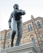  ??  ?? > The first photograph of a rugby game in 1851 and, above, Rugby School’s statue of William Webb Ellis