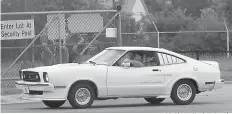  ?? AP Photo/Carlos Osorio ?? ■ A 1976 Ford King Cobra Mustang is driven outside the Flat Rock Assembly plant Wednesday in Flat Rock, Mich.