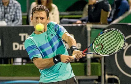  ?? PHOTO: GETTY IMAGES ?? Artem Sitak of New Zealand plays a shot against Jeremy Chardy of France at the ASB Classic last night.