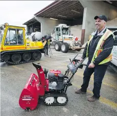  ?? JASON PAYNE ?? Ken Brown from the City of Vancouver’s engineerin­g services department shows off some of the new and upgraded equipment the city purchased for snow removal ahead of this year’s winter weather