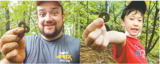  ?? Courtesy of Michael Phares ?? Michael Phares, left, and Oliver Phares, 11, go metal detecting near Namyangju in 2019.