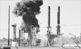  ?? STEPHEN MACGILLIVR­AY THE CANADIAN PRESS ?? Flame and smoke erupts from the Irving Oil refinery in Saint John, N.B., on Monday.