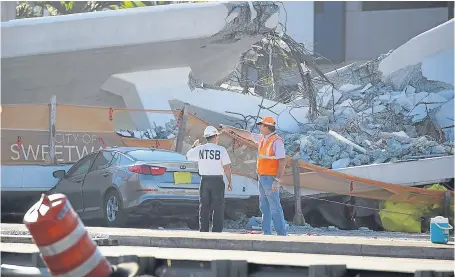  ?? Picture: Getty. ?? Members of the National Transporta­tion Safety Board investigat­e the scene.