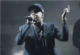  ?? [AP PHOTO] ?? In this Nov. 4 file photo, Jay Z performs during a campaign rally for Democratic presidenti­al candidate Hillary Clinton in Cleveland.