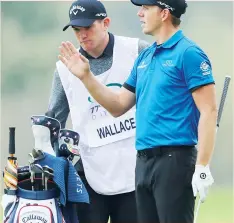  ??  ?? Valuable: Bath scrumhalf Ben Spencer, unwanted by Eddie Jones, filled in his time this week by caddying for friend Matt Wallace at the Italian Open in Brescia. Spencer’s value was appreciate­d here at least as Wallace carded eight under through the first three rounds.