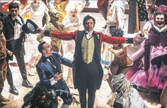  ??  ?? Hugh Jackman comes alive with a cast of circus characters in “The Greatest Showman.”