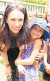  ?? Picture / NZME ?? Jacinda Ardern has her smile at the ready for a photo with Olivia Bogaers, 6, of Paihia.