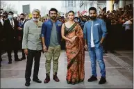  ?? Jyoti Kapoor/Pacific Press / TNS ?? N. T. Rama Rao Jr., Ram Charan, Alia Bhatt and S.S. Rajamouli during the promotion for the film “RRR,” on March 20 in New Delhi, India.