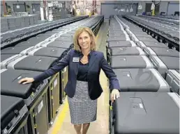  ?? CARLINE JEAN/SOUTH FLORIDA SUN SENTINEL ?? Wendy Sartory Link, Palm Beach County supervisor of elections, is seen with some of 975 voting machines in early 2020. She says President Donald Trump’s claims about mail voting are wrong.