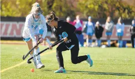  ?? BRIAN KRISTA/CAPITAL GAZETTE ?? Chesapeake's Alyssa Krueger, left, and C. Milton Wright's Annie Keele battle for control of the ball in the Class 3A field hockey state championsh­ip game at Washington College on Saturday.