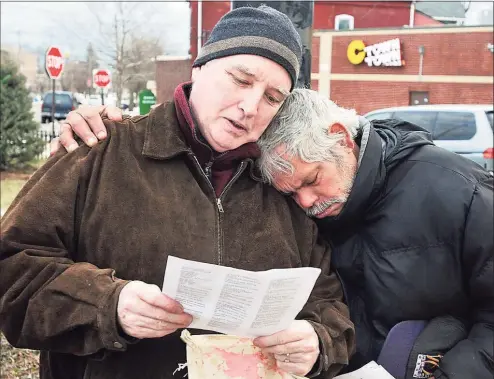  ?? Peter Casolino / Hearst Connecticu­t Media file photo ?? Mark Colville, left, and Edwin Irrizarry, both of New Haven, hug during a prayer at a rally to stop deportatio­ns, sponsored by local community action groups and churches, at the Kimberly Triangle Park in 2012.